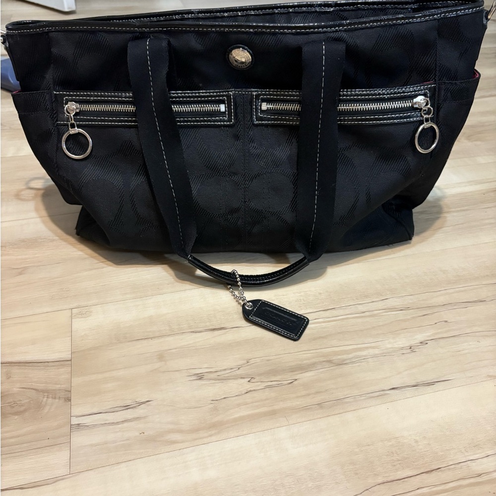 Coach Black Tote with Silver Accents

10” x 19”